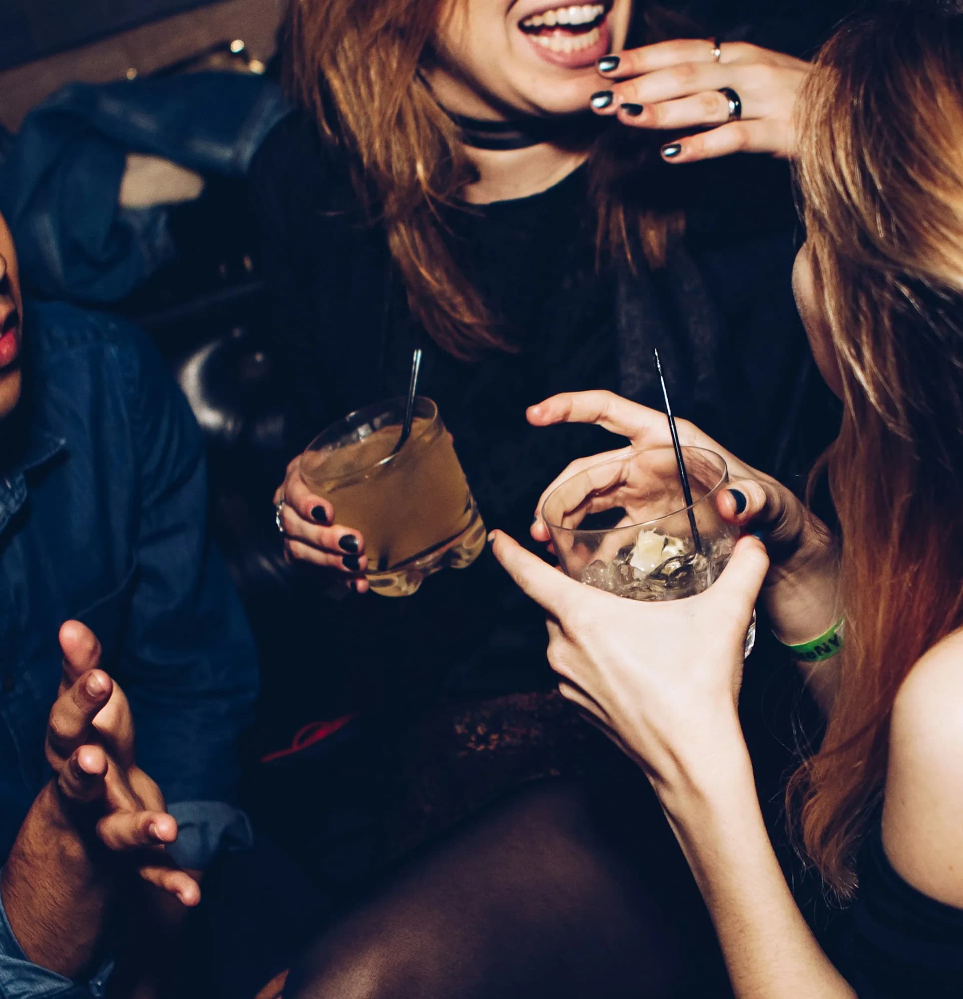 Champagne bottle service in a low-lit booth